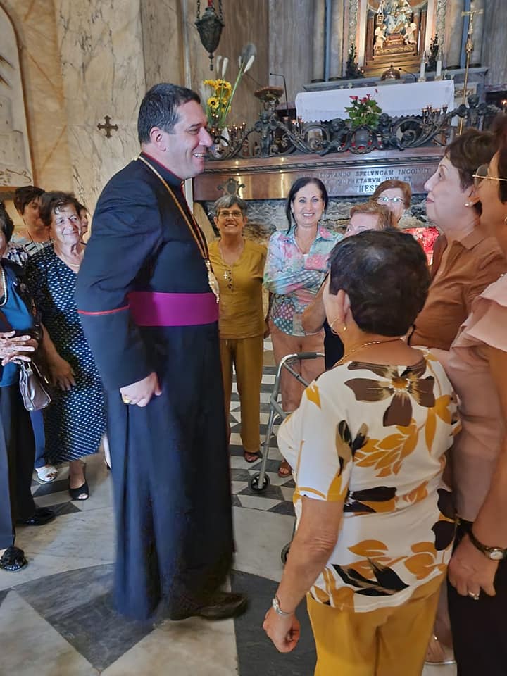 Bishop Naum talking to local visitors
